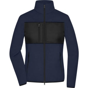 A navy ladies fleece jacket featuring a black panel across the chest, with a zippered pocket and high collar.
