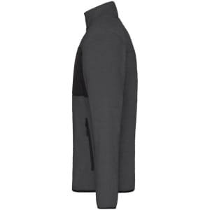 A men's fleece jacket in dark grey with a black panel and zippered pockets on the side.