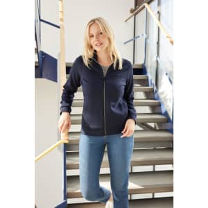 A navy ladies jacket with a zip-up front, featuring a simple design and fitted style, displayed by a model.