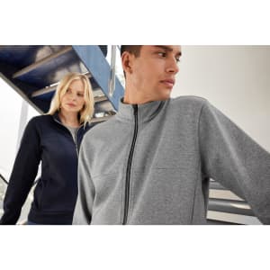 A grey zip-up jacket and a navy jacket, both featuring a logo, worn by a male and female model.