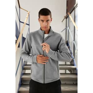 A grey men's track jacket with a zip front, featuring a high collar and a fitted design. It has a logo detail.