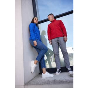 A blue and a red ladies' bonded fleece jacket displayed on models, with casual attire and footwear.