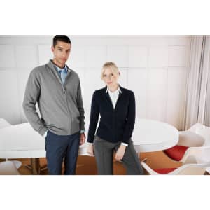 A grey men's zip cardigan and a navy women's zip cardigan, both styled in a modern meeting space.