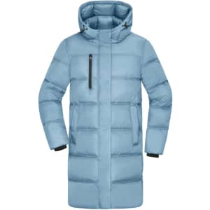 A long puffer jacket in light blue with a hood and zippered pockets. Features a logo on the front.