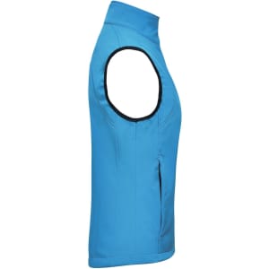 A ladies softshell vest in vibrant blue, featuring a high collar and a side zip pocket. It has a logo on the fabric.