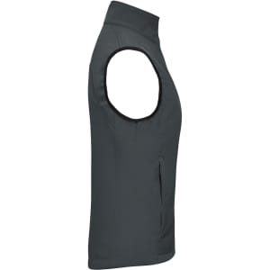A grey ladies softshell vest featuring a sleek cut, with arm holes and a zip pocket. Includes branding.