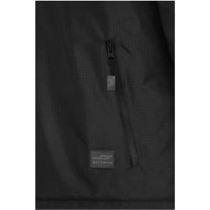 A padded hardshell workwear jacket in black featuring a zippered pocket and a branded label.