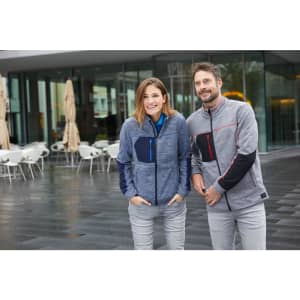 A grey polar fleece jacket featuring black and blue accents, worn by a man and woman in an outdoor setting.