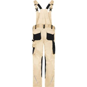 Workwear pants with bib in a beige colour, featuring black accents and multiple pockets. Includes adjustable straps and a branding logo.