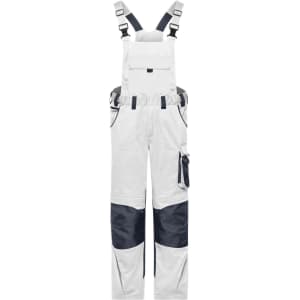 Workwear pants with bib in white and navy, featuring adjustable straps and multiple pockets. Includes branding.