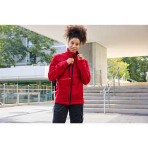 A red fleece jacket with a corduroy look, featuring a zippered front and a stylish collar. It has a logo.
