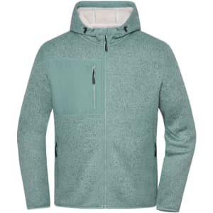 A soft shell jacket in a soft green colour with a zippered chest pocket and hood. It features a logo.