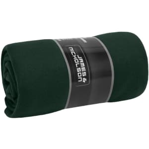 A rolled dark green fleece blanket wrapped with a label featuring a logo.