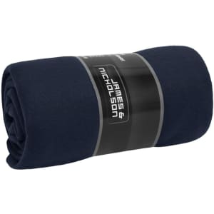 A rolled navy fleece blanket with a label featuring branding on a neutral background.