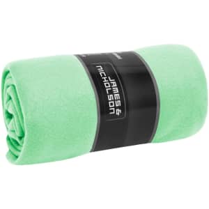A rolled fleece blanket in bright green with a black branding label around it.