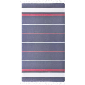 A striped beach blanket in navy blue and pink, featuring tassels along the edges and a logo in one corner.
