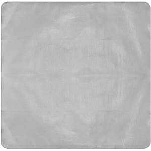 A grey picnic blanket XL featuring a smooth surface, with a logo in one corner.