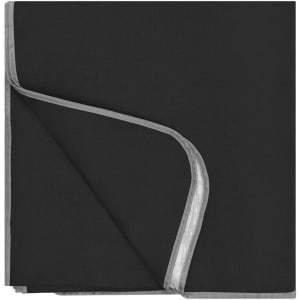A black picnic blanket with a grey trim, folded neatly to display its layered design.