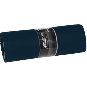 A rolled navy picnic blanket with a branded label wrapped around it.