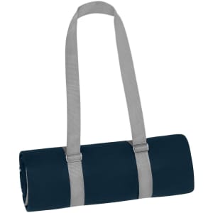 A rolled navy picnic blanket secured with grey straps, featuring a logo on the fabric.