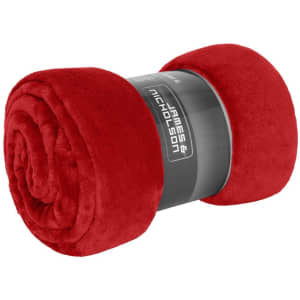 A rolled red microfibre fleece blanket XL with a black band around it featuring a logo.