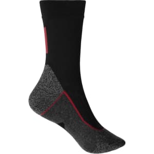 A pair of black and grey work socks with a patterned design and a logo. The socks feature red accents.
