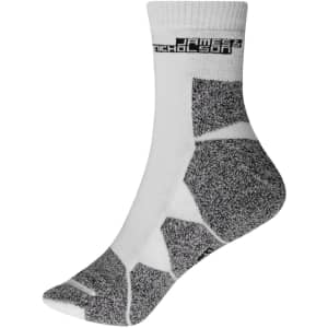 A pair of white sport socks with grey patterns and a logo on the cuff.