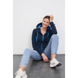 A navy blue ladies doubleface jacket with teal accents, featuring a hood and a zippered front.