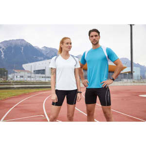 A white and blue athletic T-shirt worn by a woman and a man on a running track, with mountains in the background.