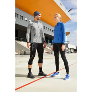 A grey sports jacket and black leggings worn by a man, and a blue sports shirt paired with black leggings worn by a woman.