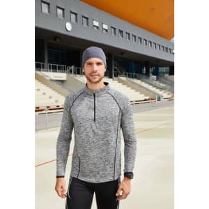 A men's long-sleeve sports shirt in grey with a half zip and black accents, displayed outdoors.