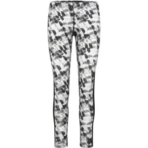 Ladies sports tights in a black, white, and grey abstract print, featuring a sleek design with side panels.
