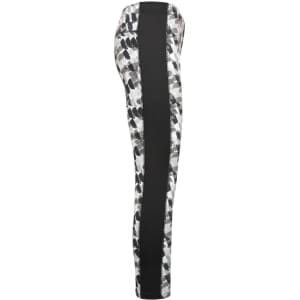 Ladies sports tights featuring a patterned design in black and white with a contrasting black side panel. Includes branding.