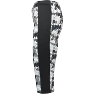 Ladies' 3/4 tights featuring a black and white abstract pattern with a solid black side panel. Includes branding.