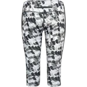 3/4 tights in a grey and white abstract print with a zip pocket and side panel detailing. Features a logo.