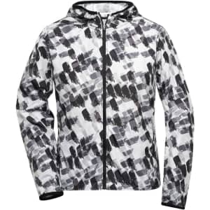 A soft shell ladies sports jacket featuring a monochrome brushstroke pattern and a hood. It has a logo on it.