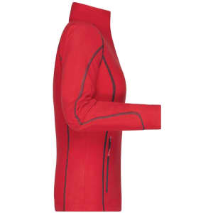 A red polar fleece jacket with a zip and fitted design, featuring seam detailing and a logo.