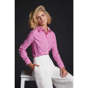 A ladies' pink and white checked blouse featuring a button-up design, styled with white trousers.