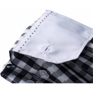A folded ladies checked blouse featuring a black and white pattern with a white collar and button details.