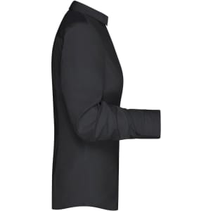 A plain black button-up shirt viewed from the side, featuring a collar and long sleeves. The shirt has a logo on it.