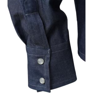 A close-up of a navy denim blouse featuring buttoned cuffs and a textured fabric. It has a brand logo.