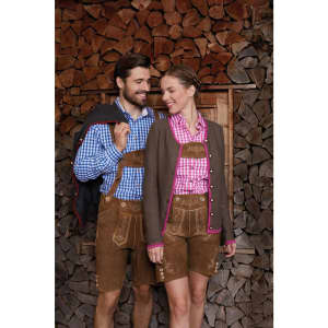 A traditional ladies' button-up shirt in pink and white check, paired with a brown cardigan and lederhosen, against a wooden backdrop.