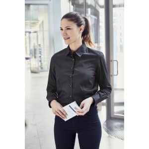 A black button-up shirt with long sleeves, featuring a collar, worn by a woman holding an envelope.