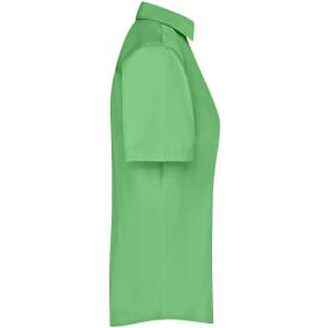 A side view of a short-sleeved ladies business shirt in bright green. The shirt features a collar and has a logo.