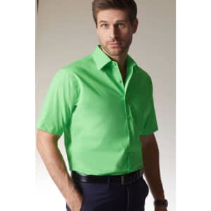 A bright green short-sleeved button-up shirt worn by a man, featuring a logo on the chest.