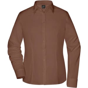 A button-up shirt in a warm brown colour with a classic collar and long sleeves. Features a logo on the tag.