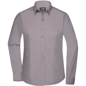 A button-up ladies shirt in light grey with long sleeves and a collar, featuring a logo on the upper label.