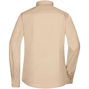 A button-up women's shirt in a light beige colour, featuring long sleeves and a collar. Contains a branding logo.