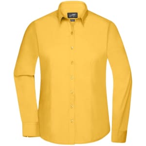 A yellow button-up ladies' shirt with long sleeves and a collar, featuring a logo.