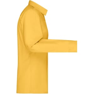 A yellow button-up ladies' shirt with a long sleeve and a collar, featuring a logo on the side.